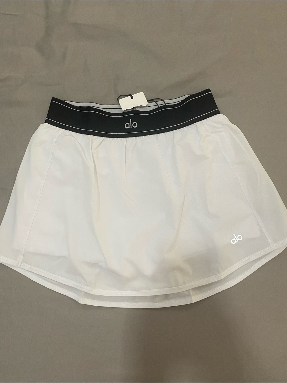 ALO Yoga Match Point White Mini Skirt with Black Waistband